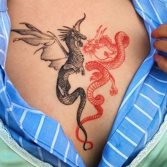 dragones tatoo pecho mujer